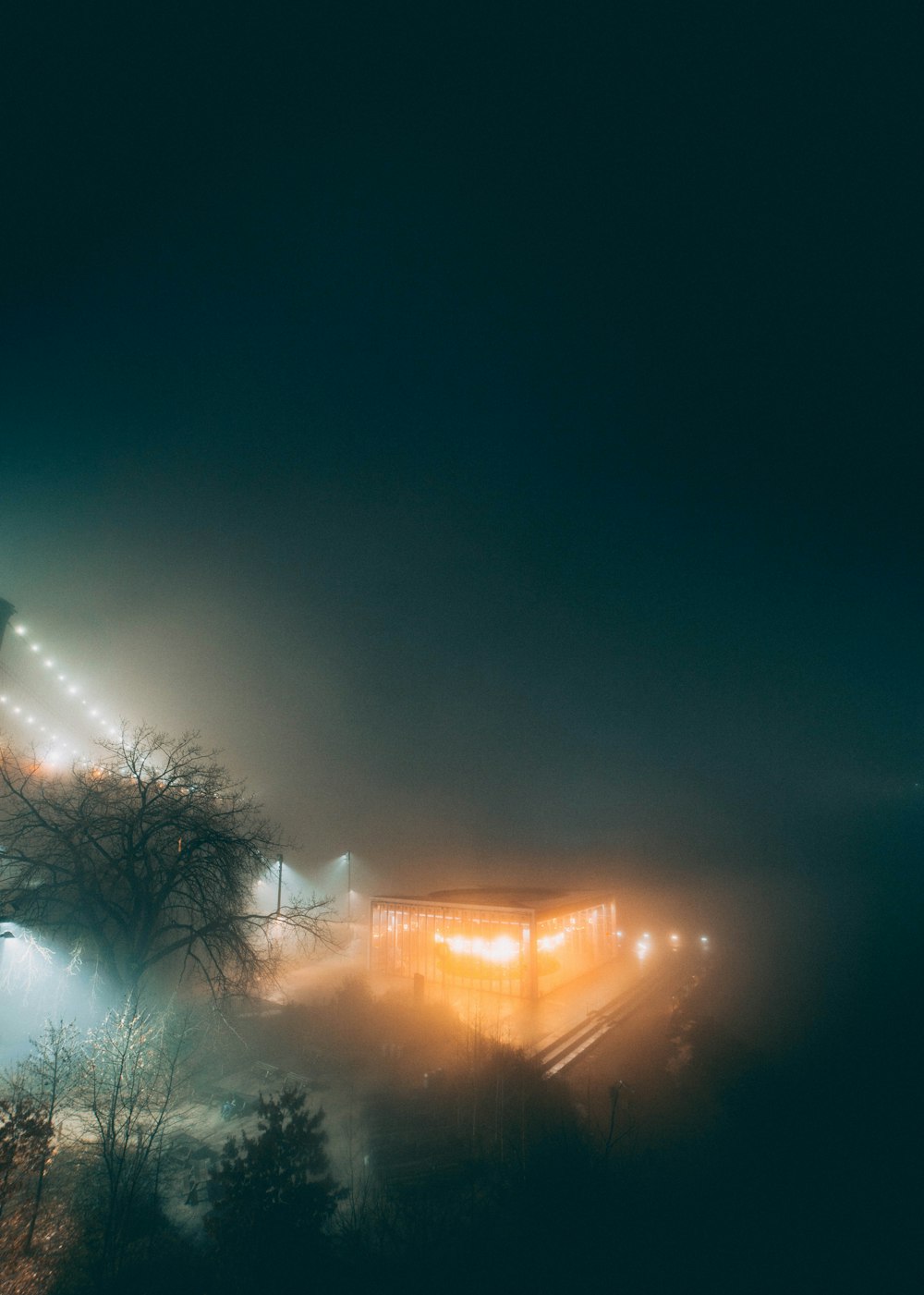 a foggy night with a train on the tracks