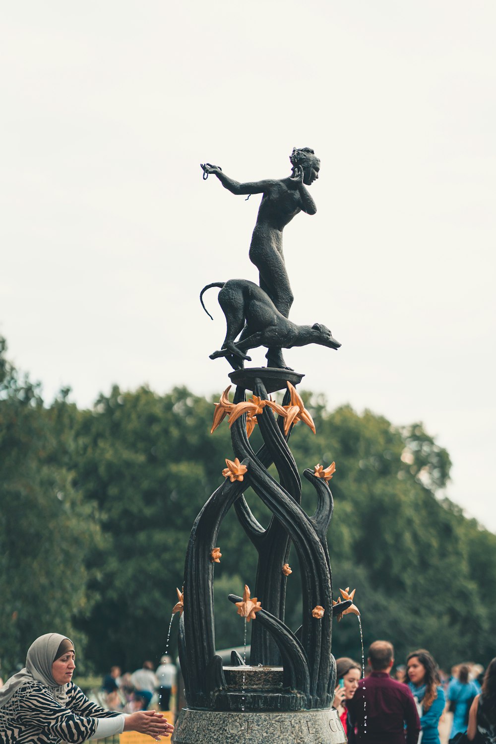 man and dog statue