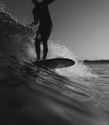 man riding on surfboard