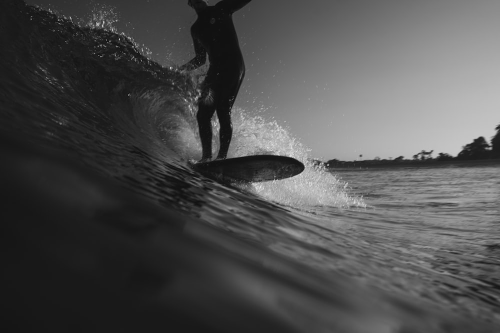 man riding on surfboard