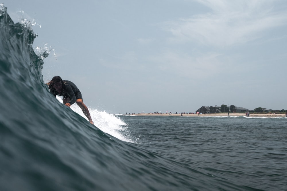 man surfing on focus photography