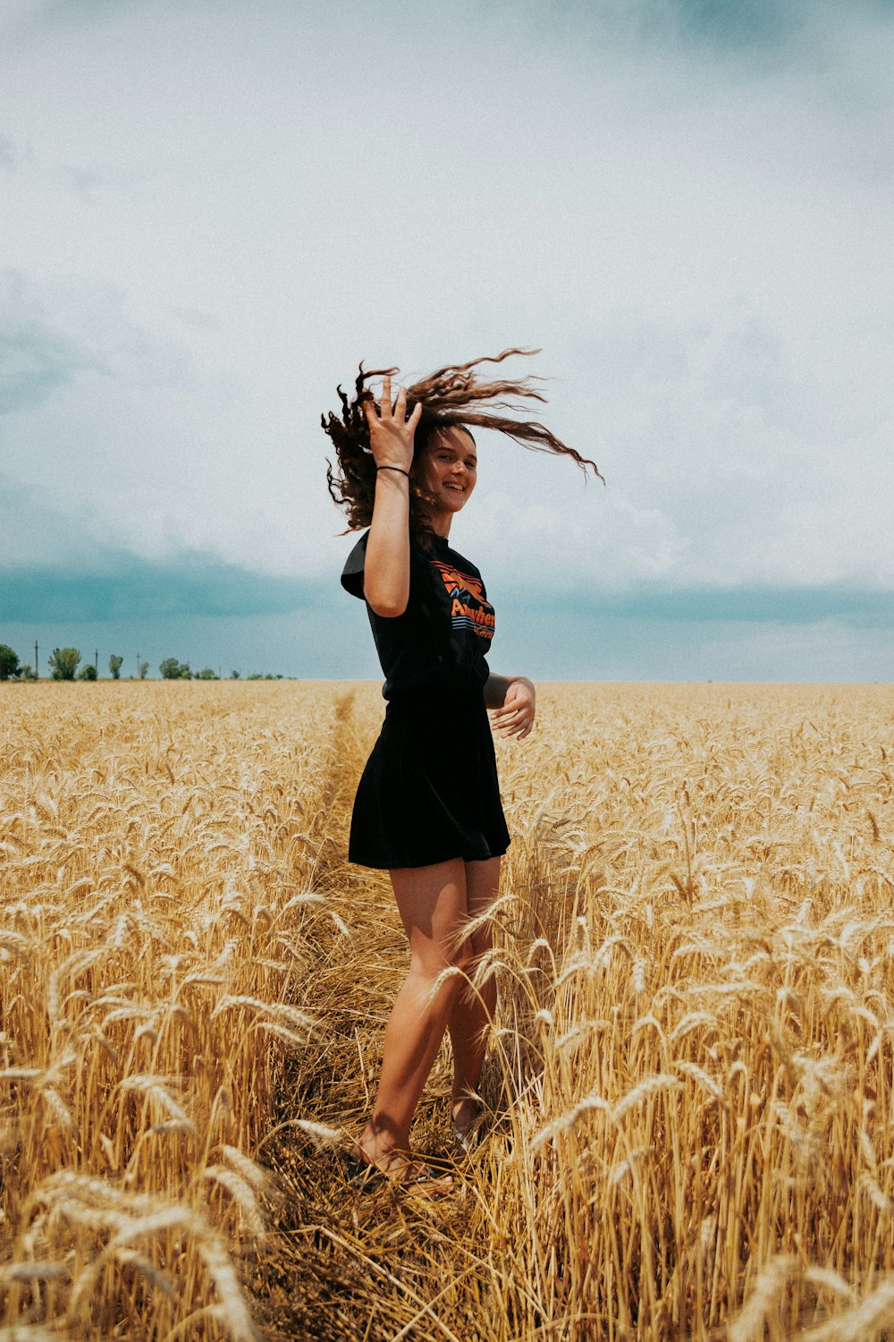 woman standing near whey fiel