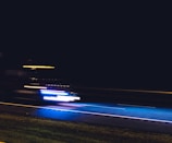 A grainy photo of a getaway vehicle speeding away from a crime scene.