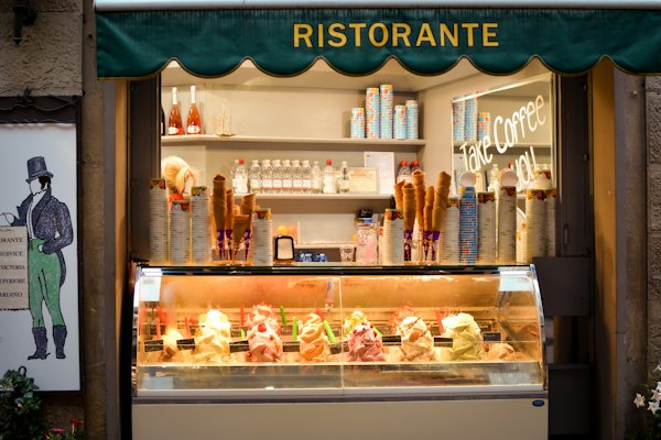 Assorted cakes in cake glass rack — Florence, Italy
