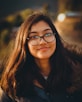 woman in black-framed eyeglasses