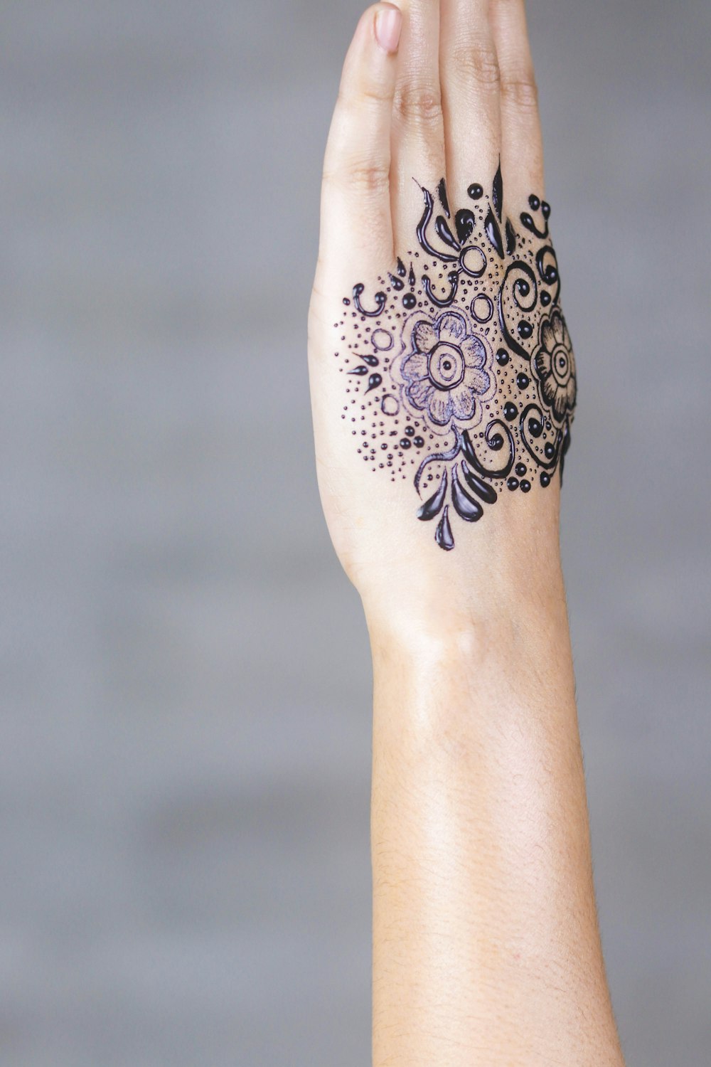 person's purple petaled flower tattoo