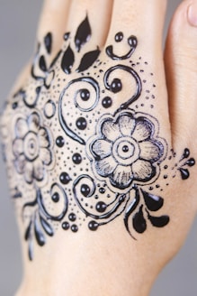 black floral hand tattoo art