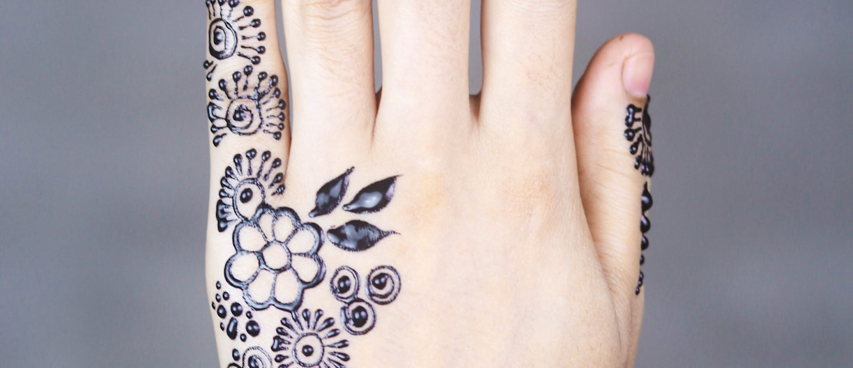 black-ink floral arm tattoo