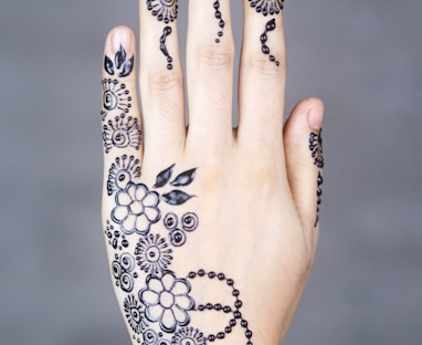 black-ink floral arm tattoo