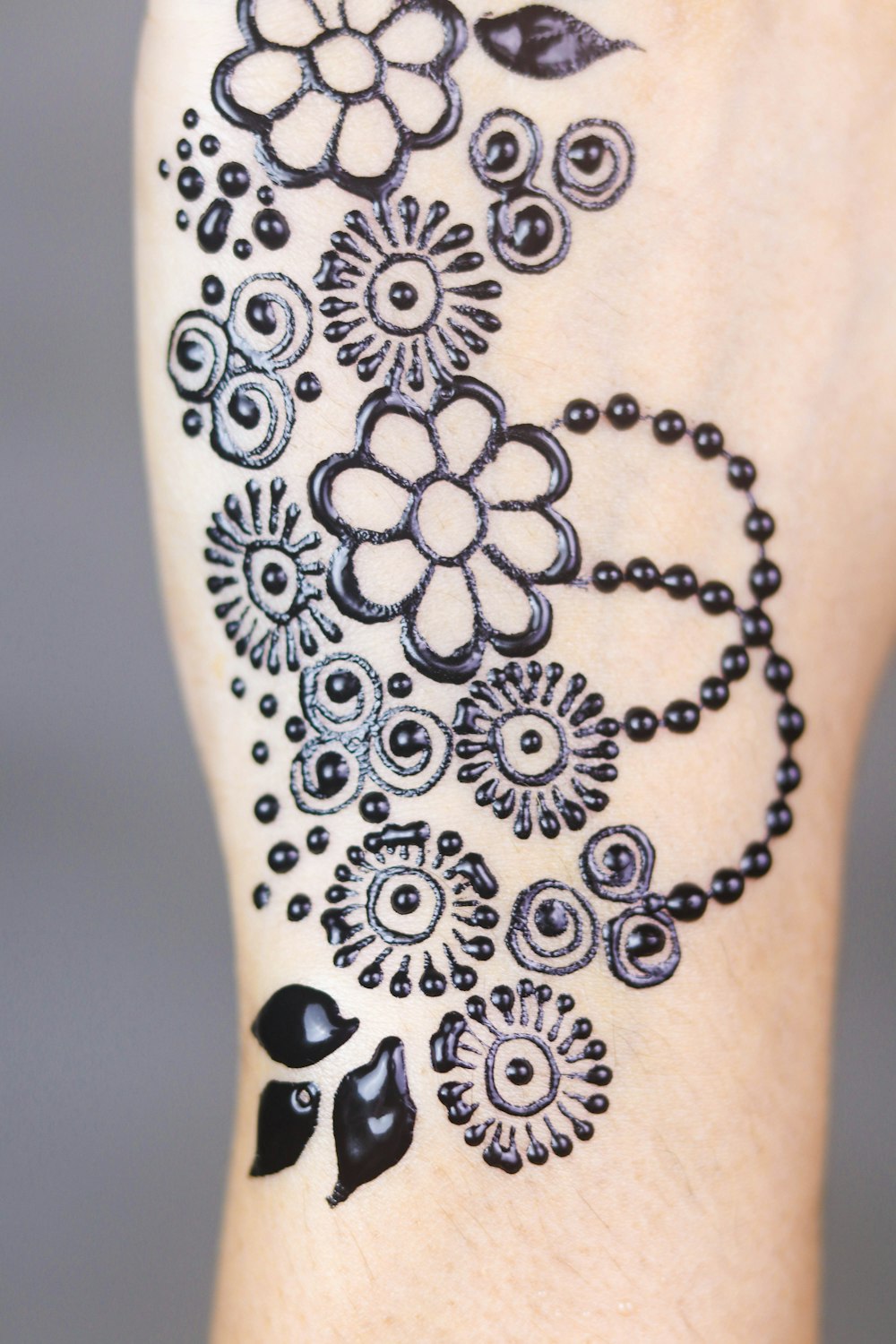 person's petaled flower tattoo