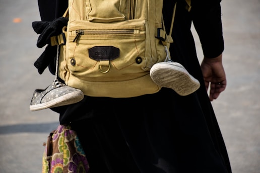 pair of sneakers on backpack