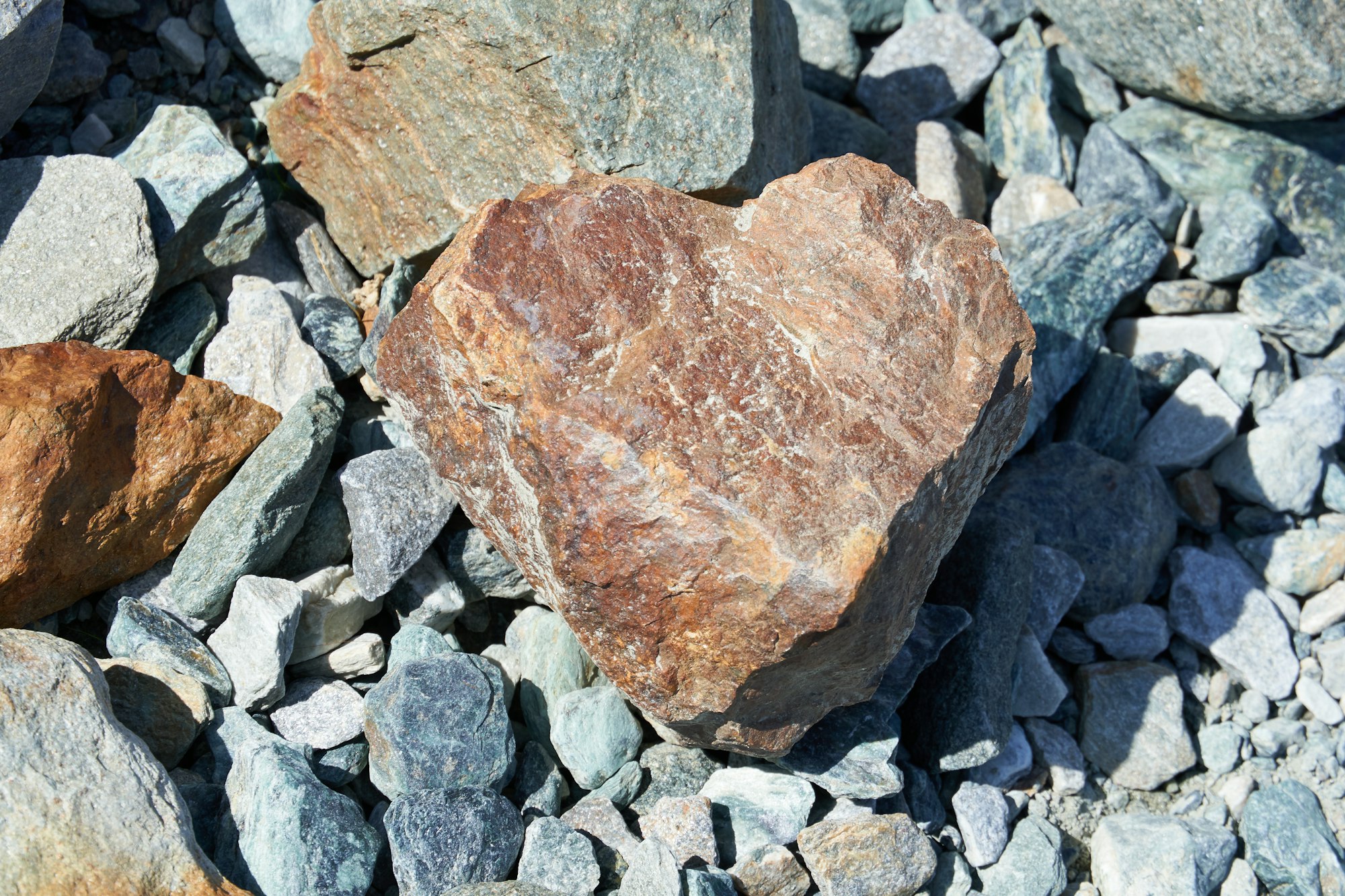 Heart-shaped stone atop smaller stones.