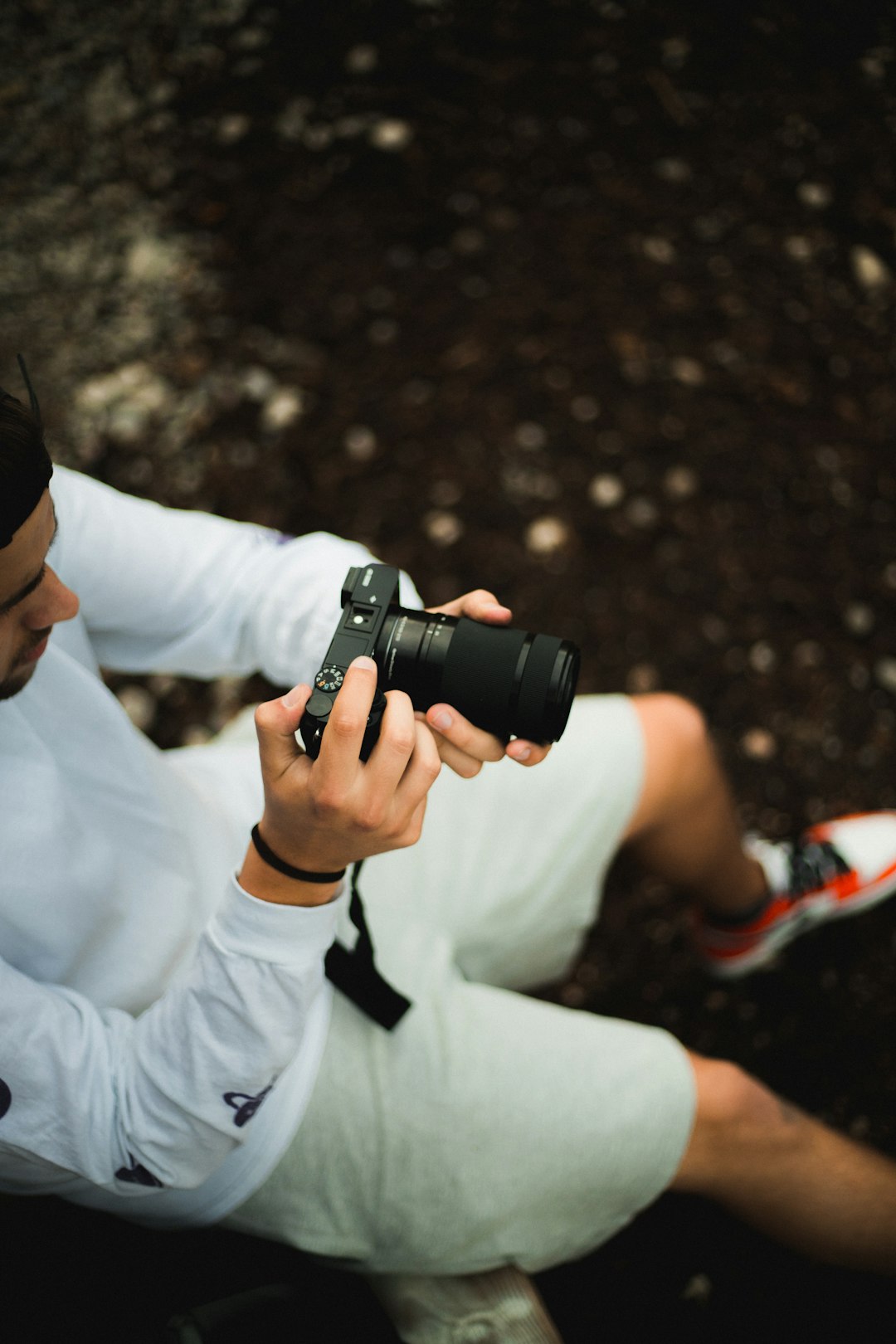 man holding black bridge camera