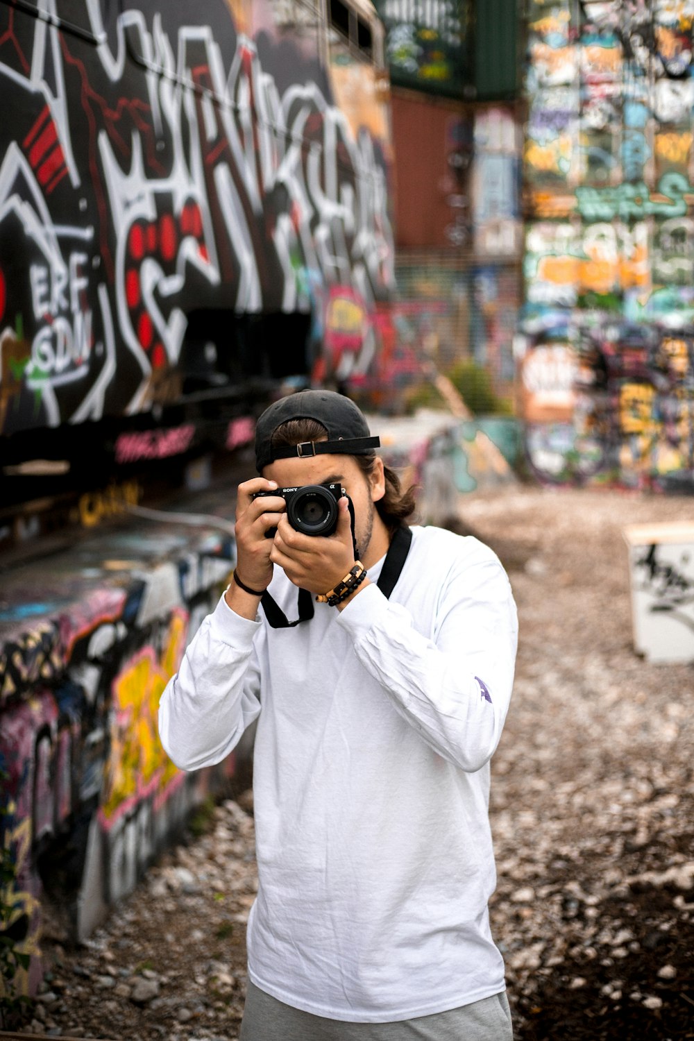 man standing beside wall