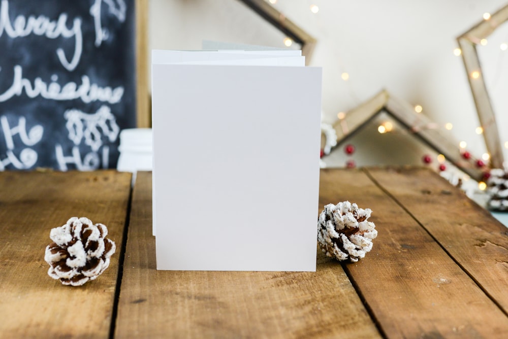 standing white folding papers on wooden surface