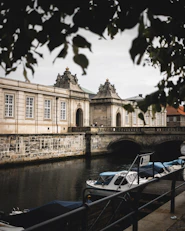 white motorboat on calm body of water
