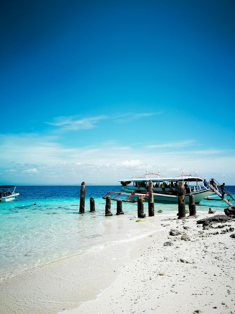 white boat on body of water