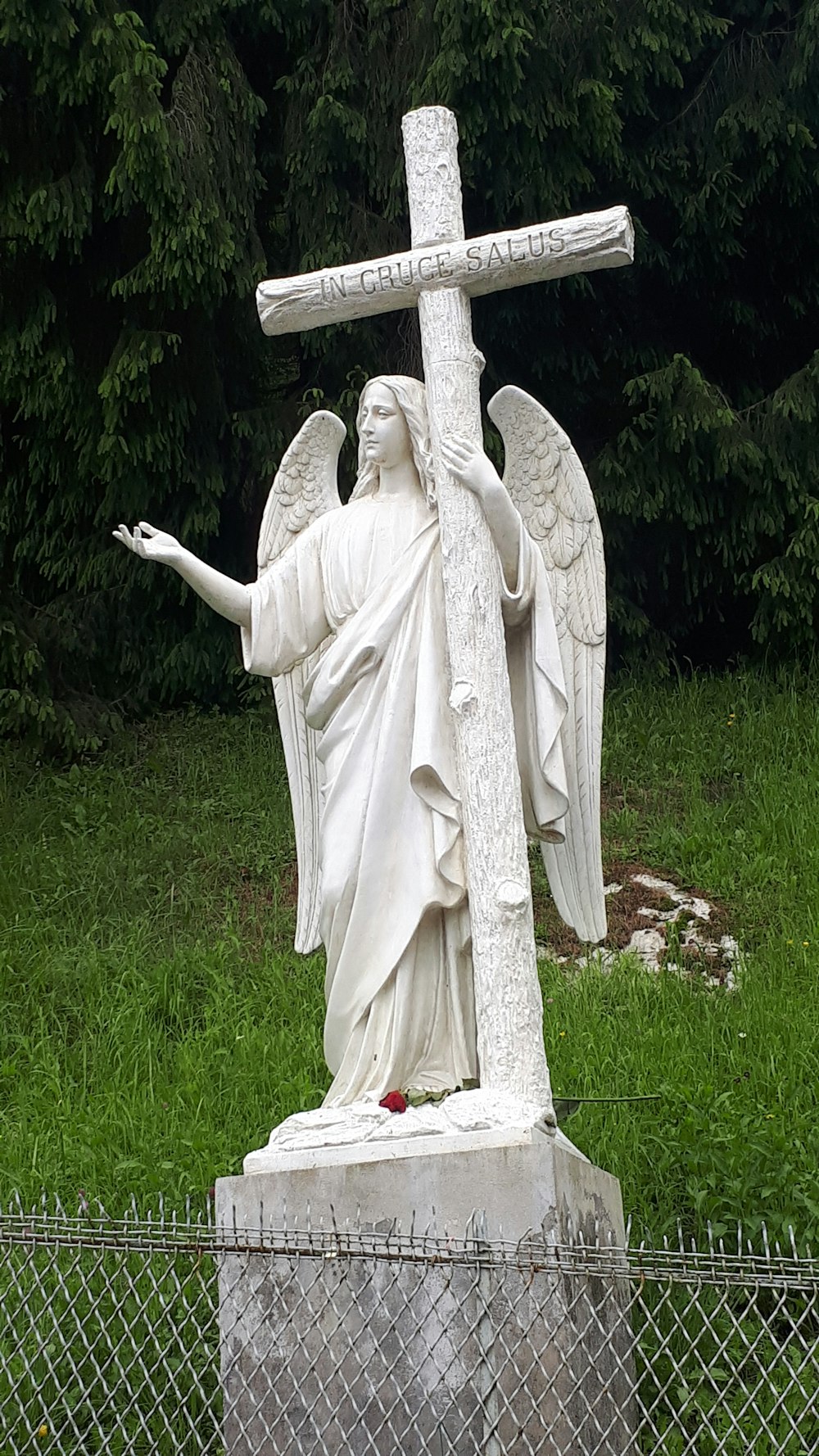 religious statue on body of water