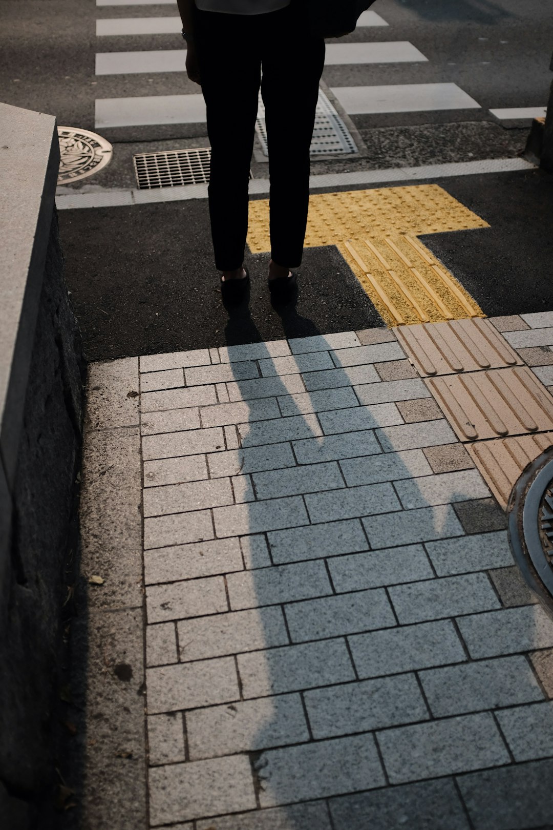 person standing beside road