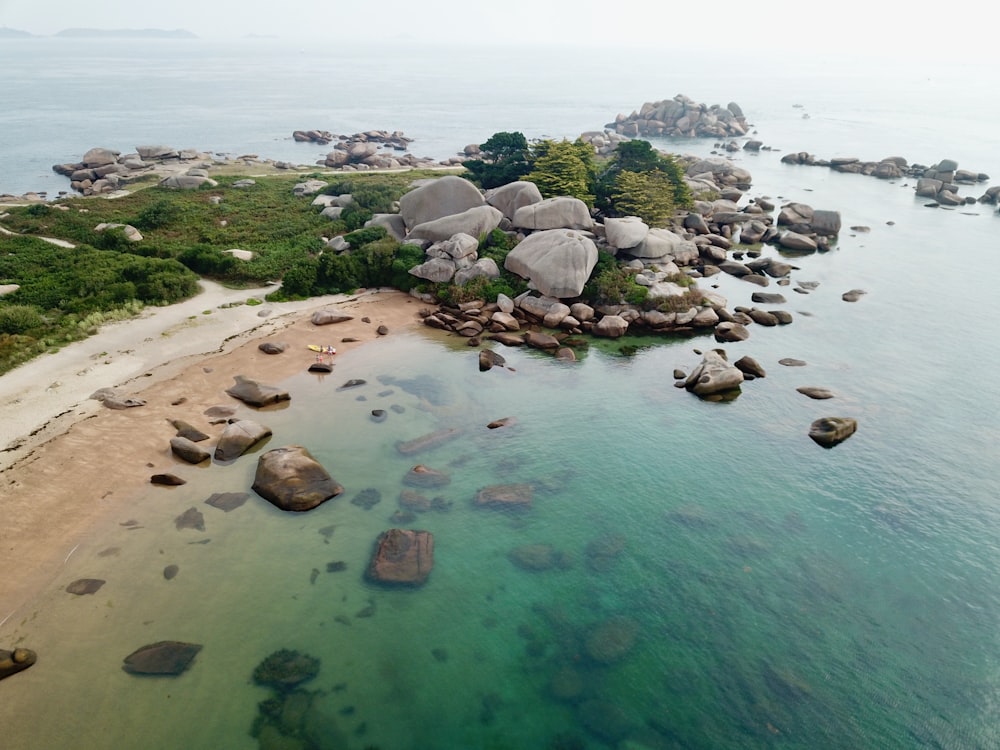 calm water near rocks