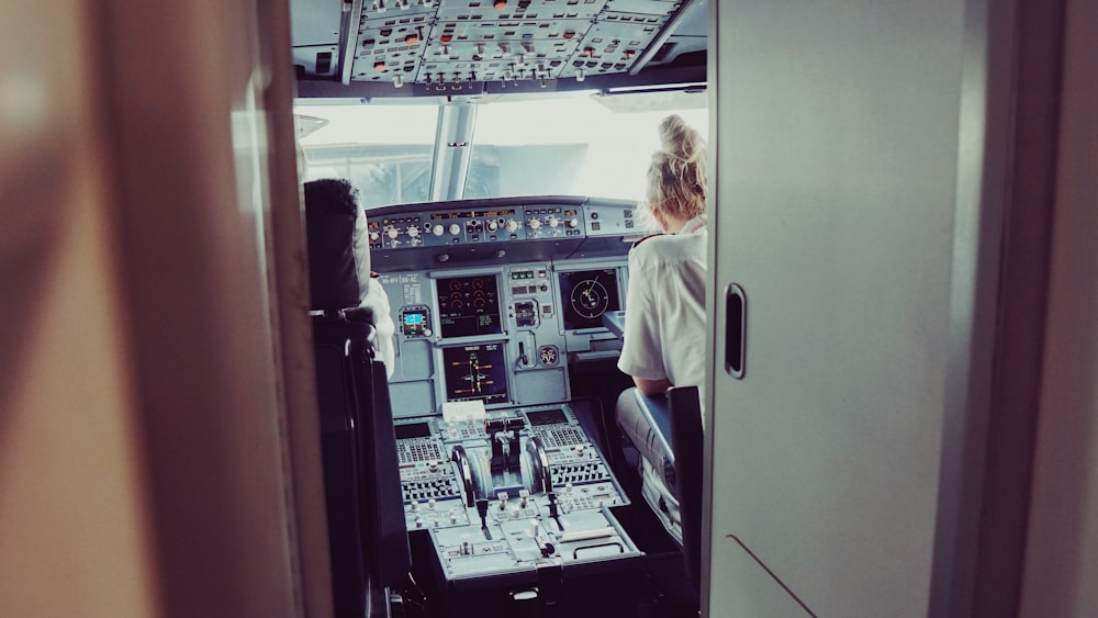 woman sitting on pilot deck