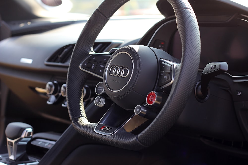 black and gray Audi steering wheel