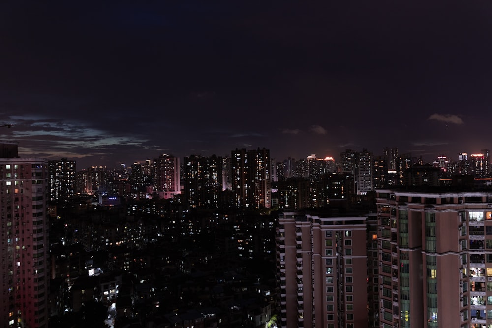 a view of a city at night from a high rise building