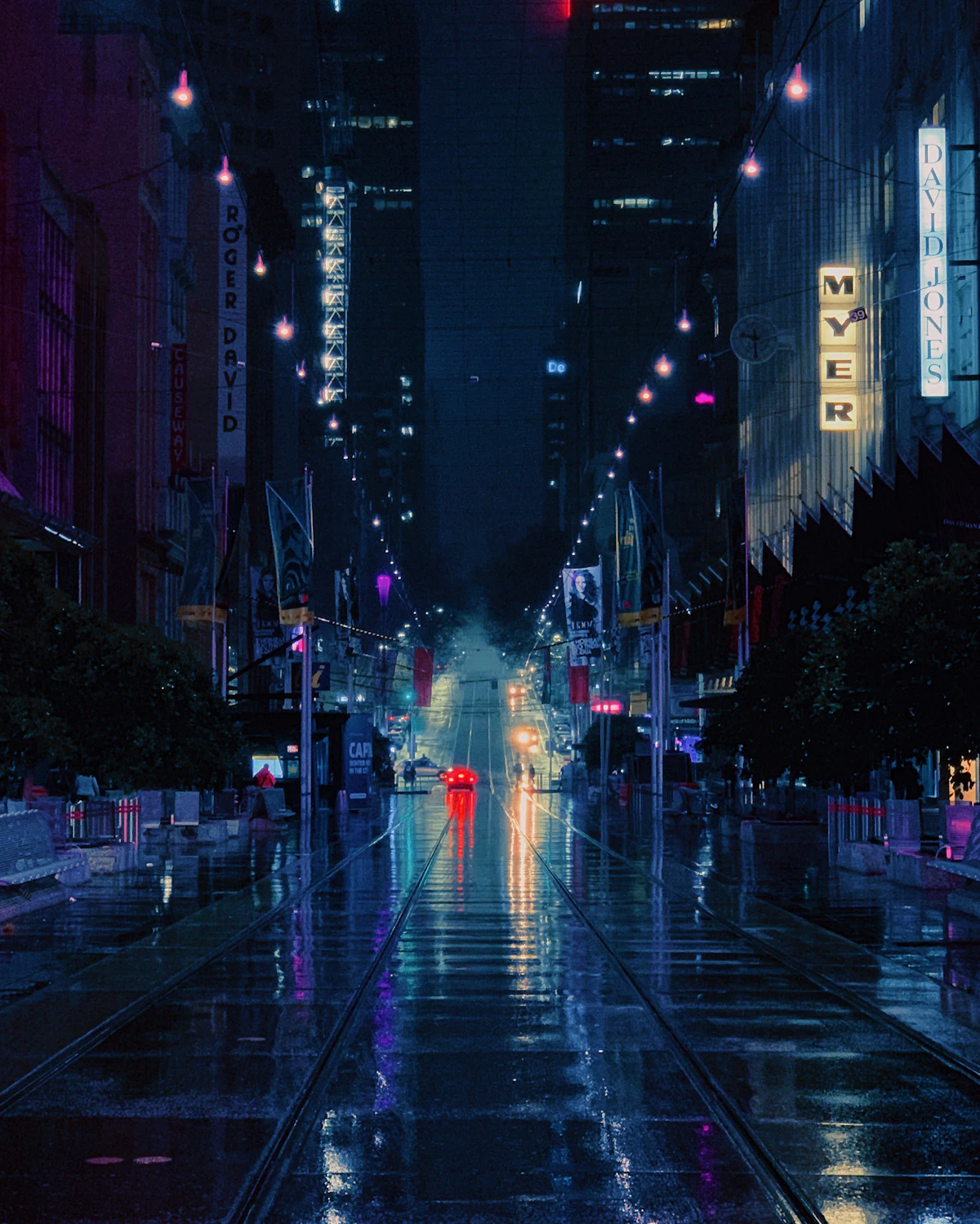 An empty road stretching between futuristic glass and steel buildings
