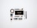 A collection of makeup products arranged neatly on a white surface. Items include multiple brushes, eyeliner, foundation, a makeup palette, and lipstick. The products are evenly spaced and organized, presenting a clean and minimalist aesthetic.