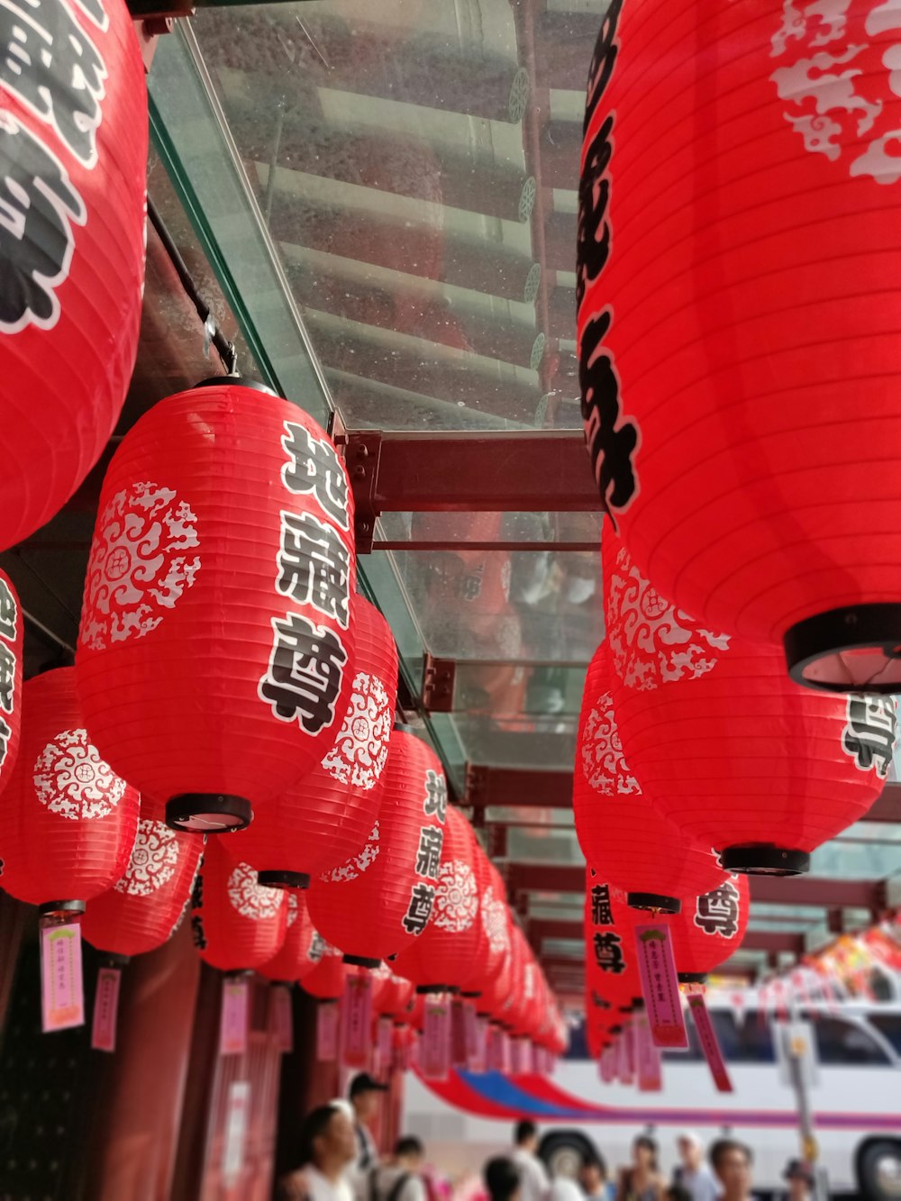 red lanterns hanging from a ceiling in a store