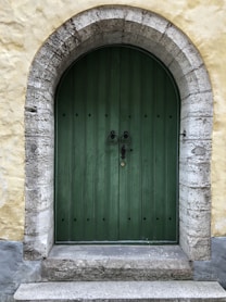 green door with black knocker
