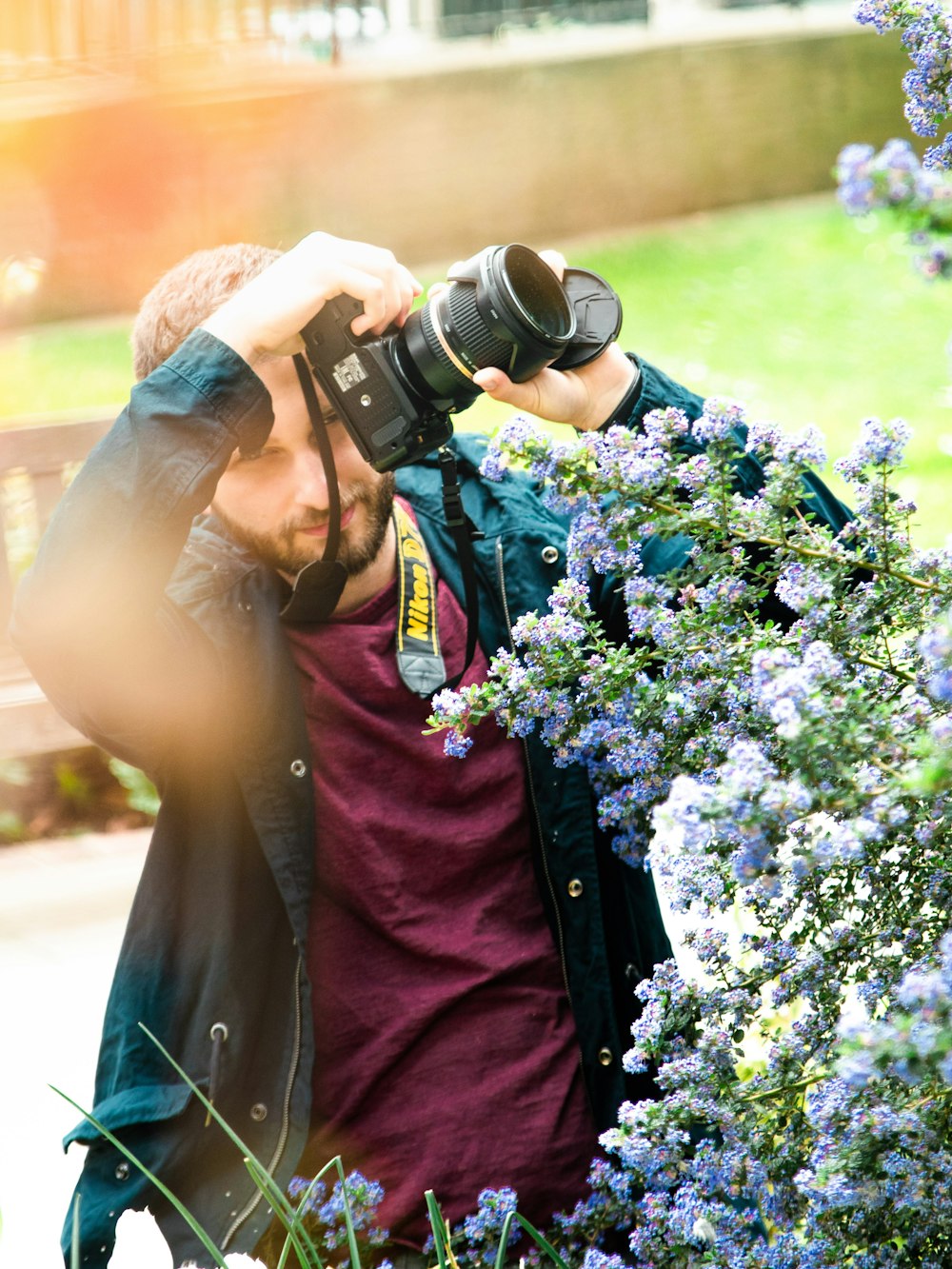 man holding DSLR camera