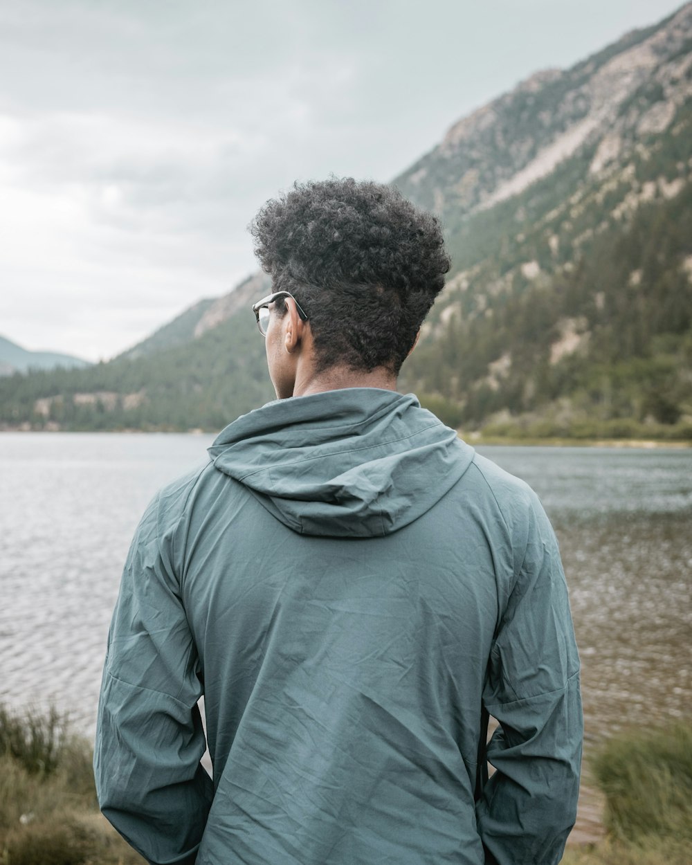 man standing infront of the river