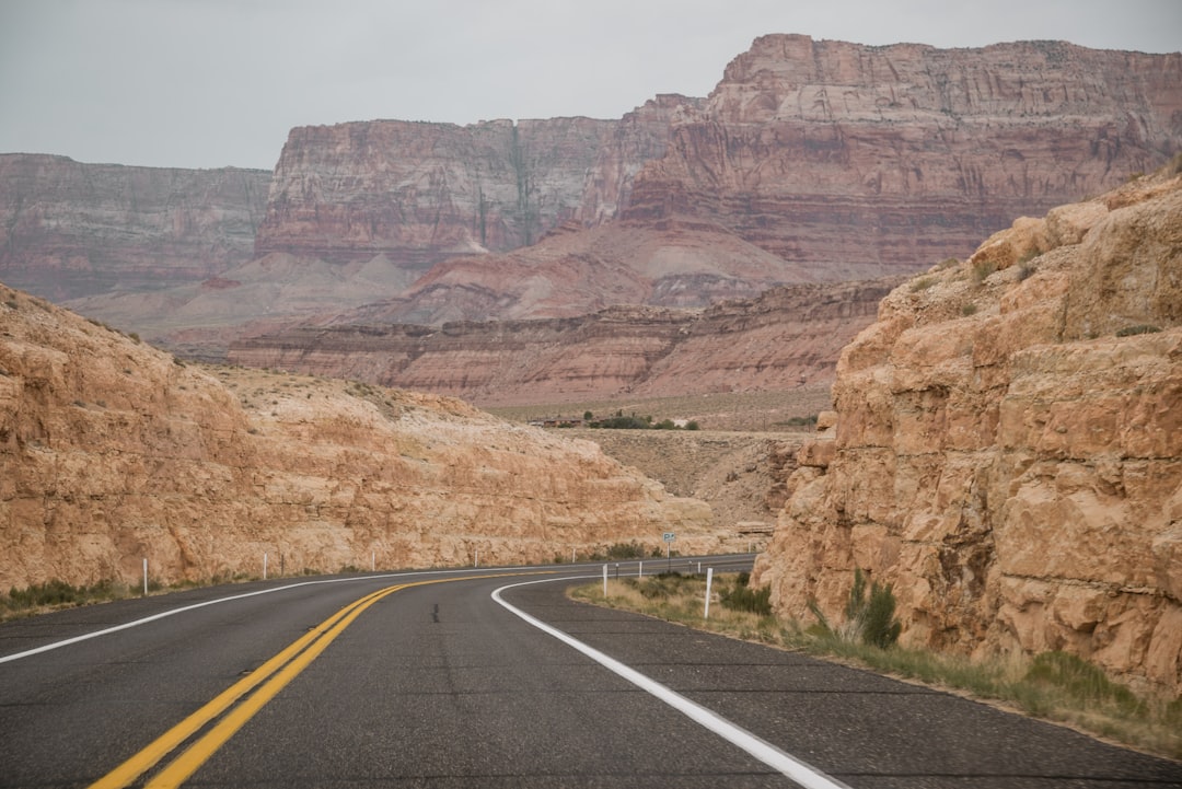 gray concrete road between mountains