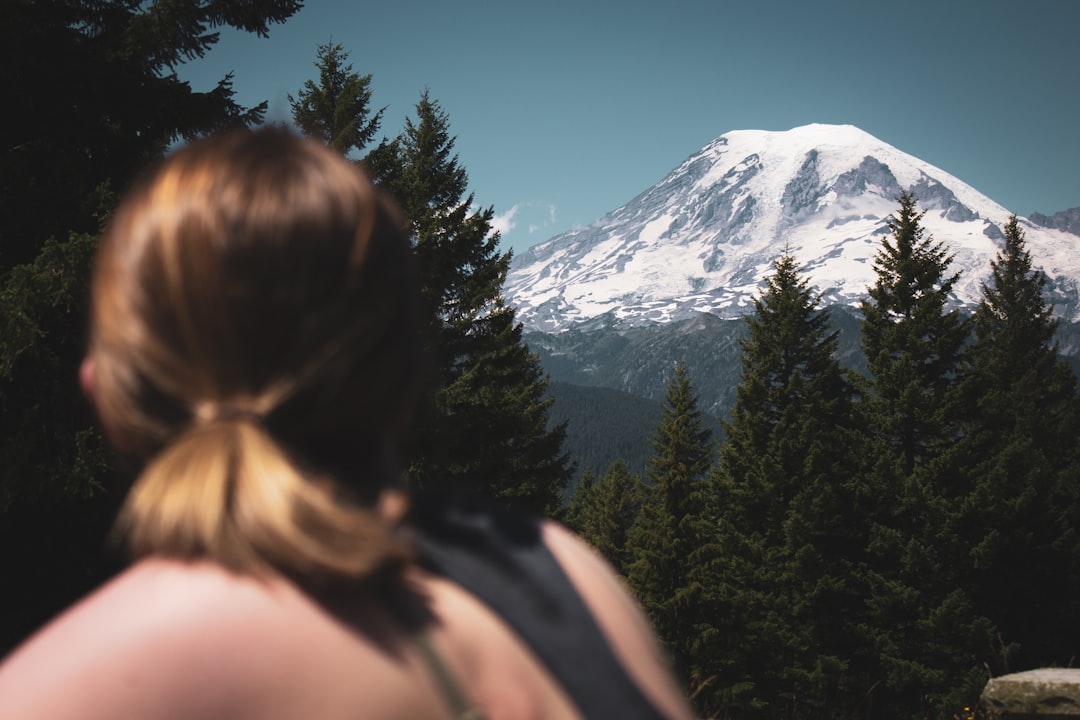 woman looking at white mountain