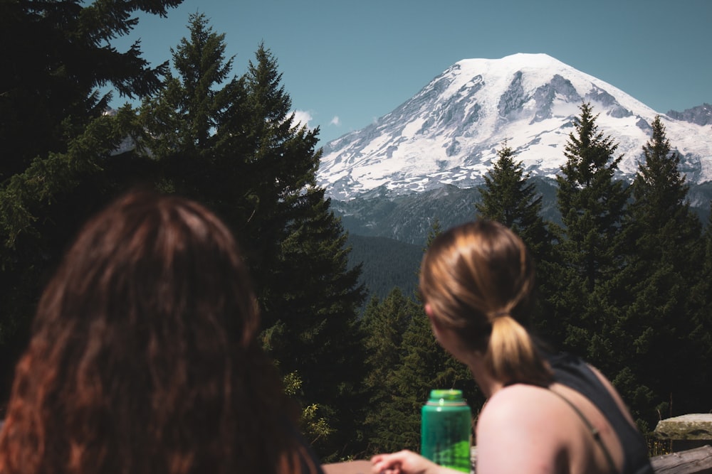 two women looking at the mountain