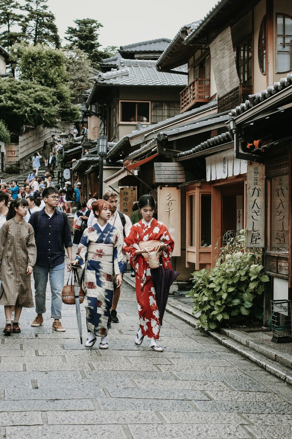 two women wearing kimonos