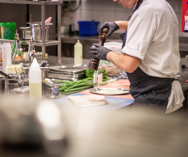 Kitchen staff producing gourmet meal with KDS