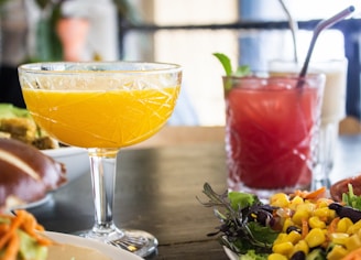 Close-up of a beautifully arranged table with traditional Brazilian appetizers and colorful drinks.