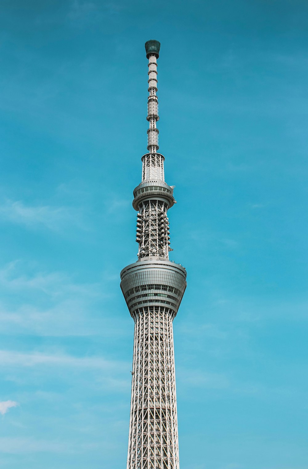 gray metal tower under blue sky