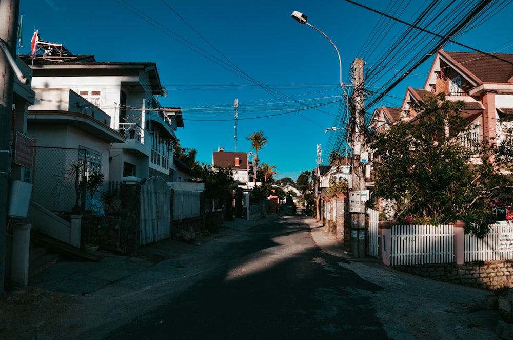 white and brown houses near gray road