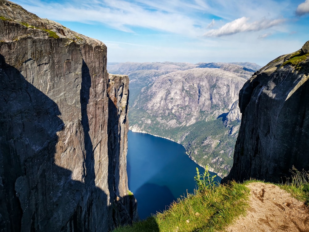 panoramic photography of cliff near body of water during daytime