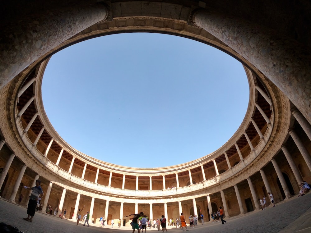 people inside building with open roof