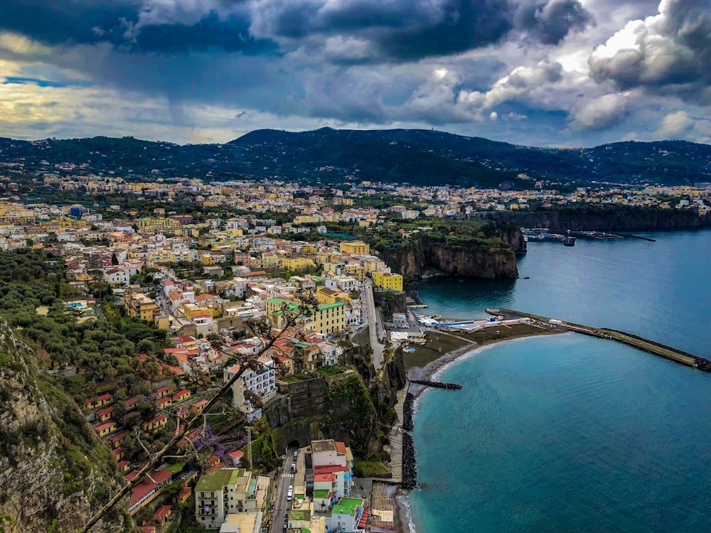 aerial photography of buildings beside seashore during daytime