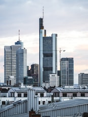 grey high-rise buildings under grey cloudy sky