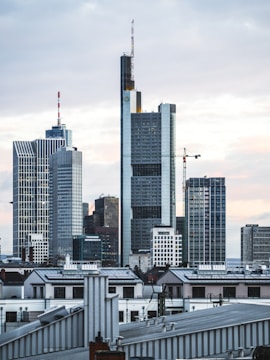 grey high-rise buildings under grey cloudy sky