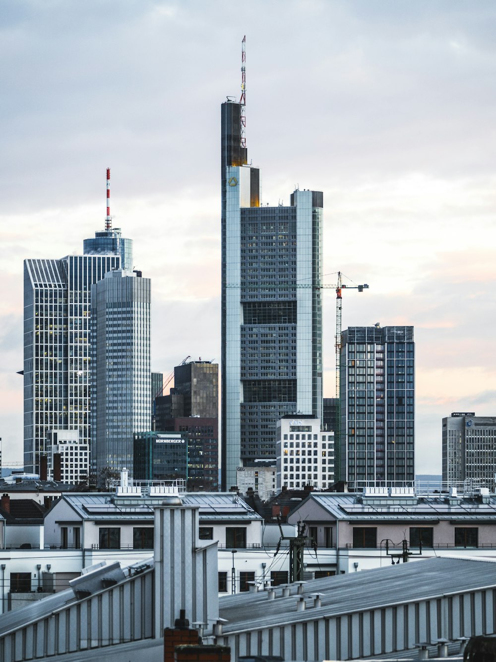 grey high-rise buildings under grey cloudy sky