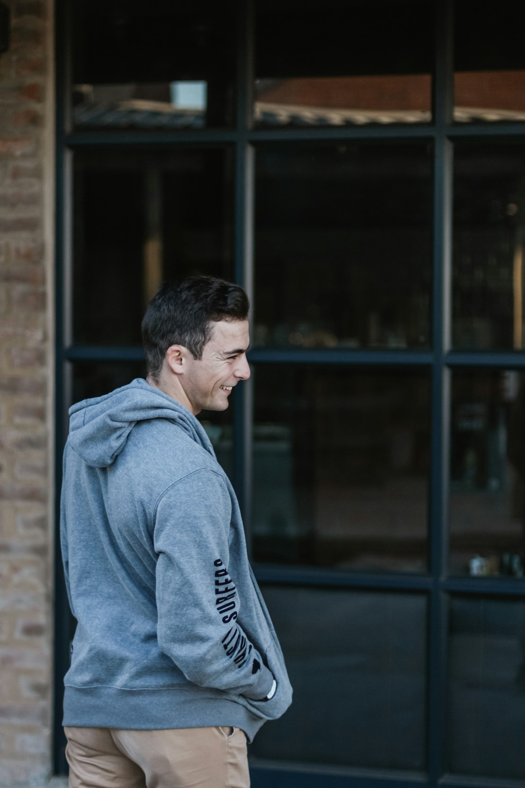 man standing in front of glass wall