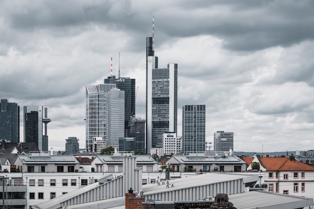 grey concrete buildings under grey clouds