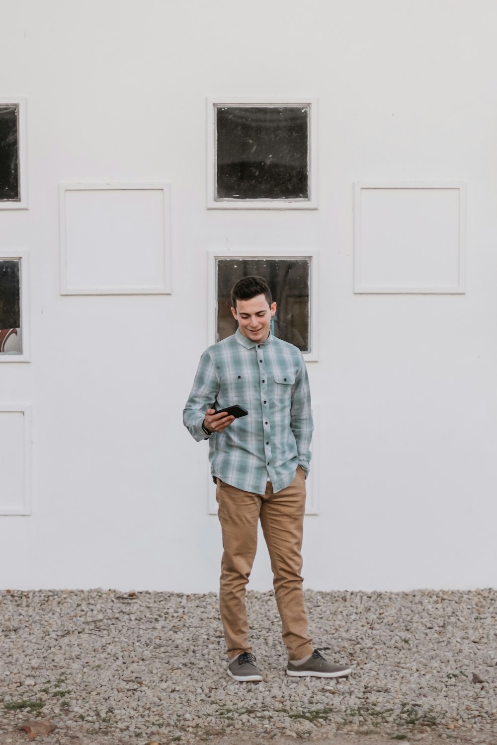 men's standing beside building